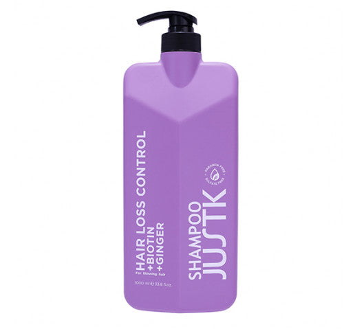 Purple hair loss control shampoo bottle with black pump, front label visible