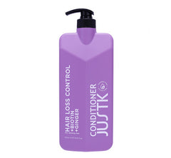 Purple hair conditioner bottle with black pump dispenser
