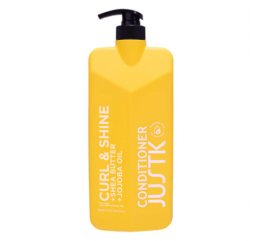 Yellow hair conditioner bottle with black pump, labeled Curl & Shine Jutk