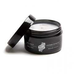 Sea salt creme pomade jar with open lid, white cream inside, black label
