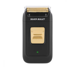 Electric foil shaver with black body, gold shaving head and green indicator light