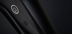 Hair straightener control panel with power icon and steam vent details