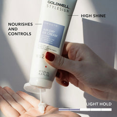 Goldwell StyleSign Air-Dry BB Cream tube squeezing onto open palm
