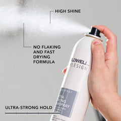 Hand holding Goldwell StyleSign extra strong hairspray bottle with black cap