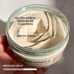 Open jar of beige matte finish paste with smooth swirl, medium hold