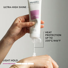 Goldwell StyleSign straightening balm tube held in hand, pink label with nozzle.