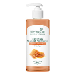 Biotique honey gel foaming face wash bottle with pump, amber-orange liquid container