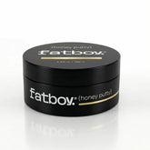 Black hair putty jar with gold label, honey putty