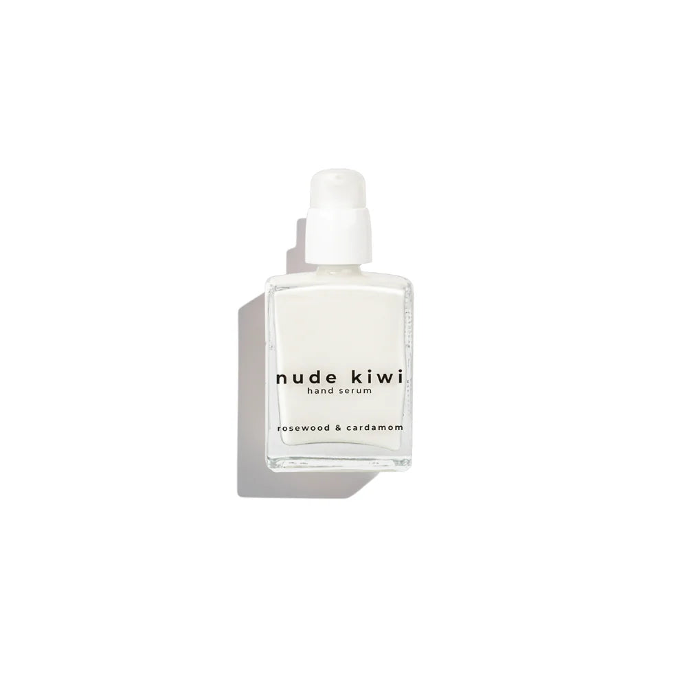 Clear glass hand serum bottle with white pump, square label