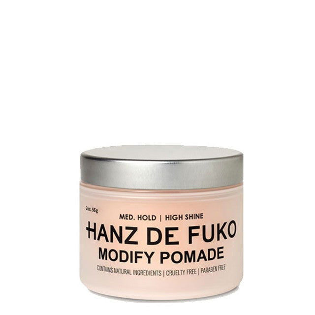 Hair pomade jar in light beige with metallic silver lid