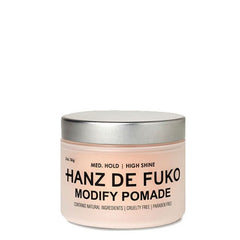 Hair pomade jar in light beige with metallic silver lid