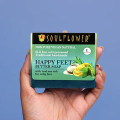 Happy Feet butter soap box held in hand, blue-green label with sea salt