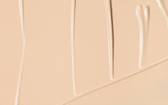 Smooth beige cream swatch with glossy streaks