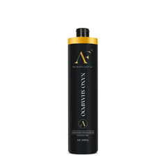 Hair shampoo bottle with black body and gold top and label