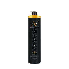 Hair treatment bottle with black body and gold top and label