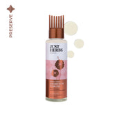 Hair oil bottle with copper cap and pink floral label, 100 ml glass bottle