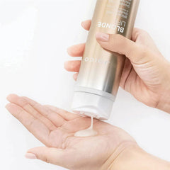 Joico Blonde Life brightening shampoo, silver bottle dispensing into palm