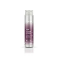 Joico Defy Damage protective shampoo bottle, silver and purple label, 300 ml