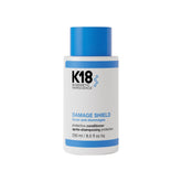 K18 Damage Shield protective conditioner bottle with blue cap.