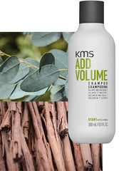 Shampoo bottle with white label reading KMS Add Volume and Volume shampoo