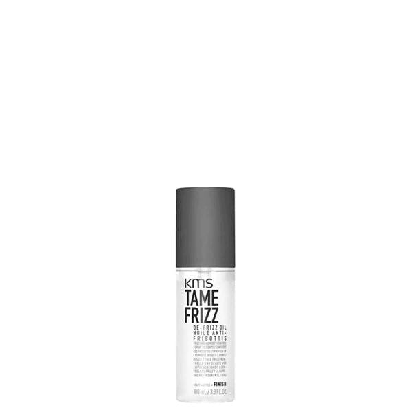 KMS Tame Frizz De-Frizz Oil bottle with dark cap and white label