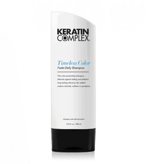 Shampoo bottle, Keratin Complex Timeless Color face-defy, white with black cap.
