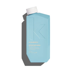 Light blue shampoo bottle with cap, labeled Repair-Me Wash by Kevin Murphy