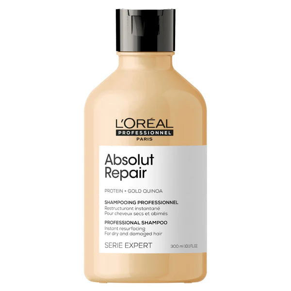 Beige shampoo bottle with black cap, Absolut Repair label