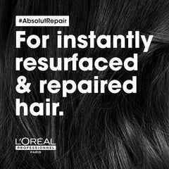 Dark hair close-up with #AbsolutRepair and repair message text