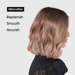 Blondified hair after treatment, shoulder-length pale blonde bob with soft waves