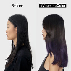 Side profile model with dark hair and purple-toned ends