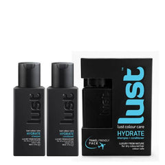Hydrate haircare travel duo with two dark bottles and black box