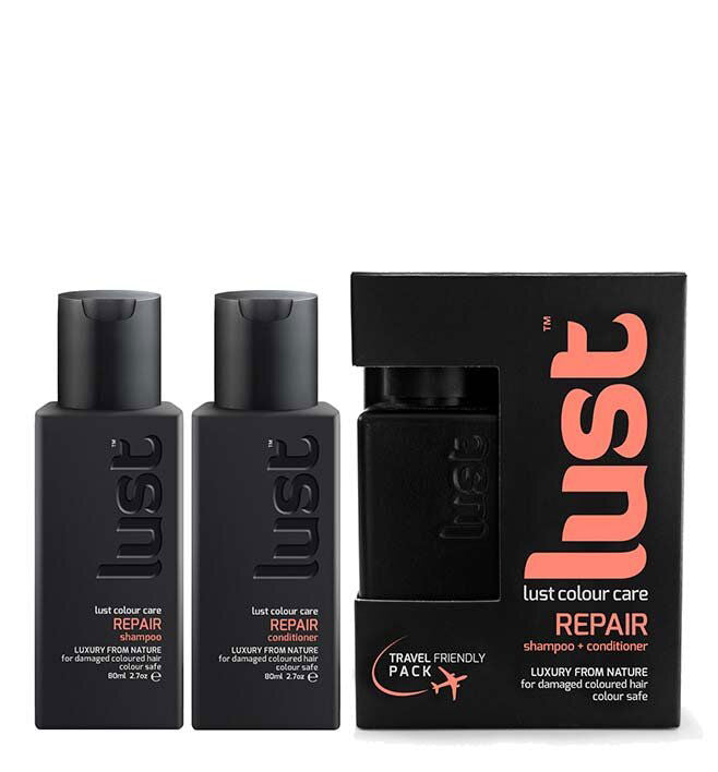 Haircare travel duo: two dark bottles and black Lust Repair carton box