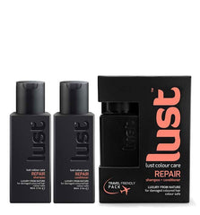 Haircare travel duo: two dark bottles and black Lust Repair carton box