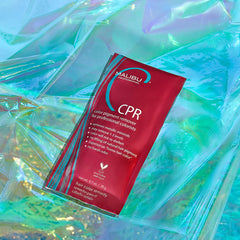 Red CPR color pigment remover sachet on crinkled plastic wrap