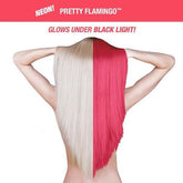 Two-tone hair dye on hair strands, blonde on one side and vivid pink-red on the other
