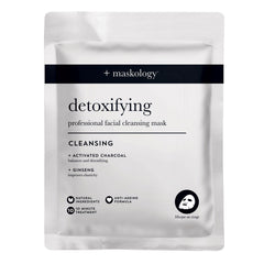 Detoxifying professional facial cleansing sheet mask in white foil pouch with charcoal text