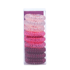 Pink coiled hair rings in clear box packaging