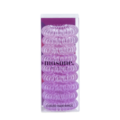 Coiled hair rings in violet-purple spiral twists, in Masone packaging