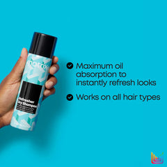 Hand holding Matrix dry shampoo bottle with teal label and black cap