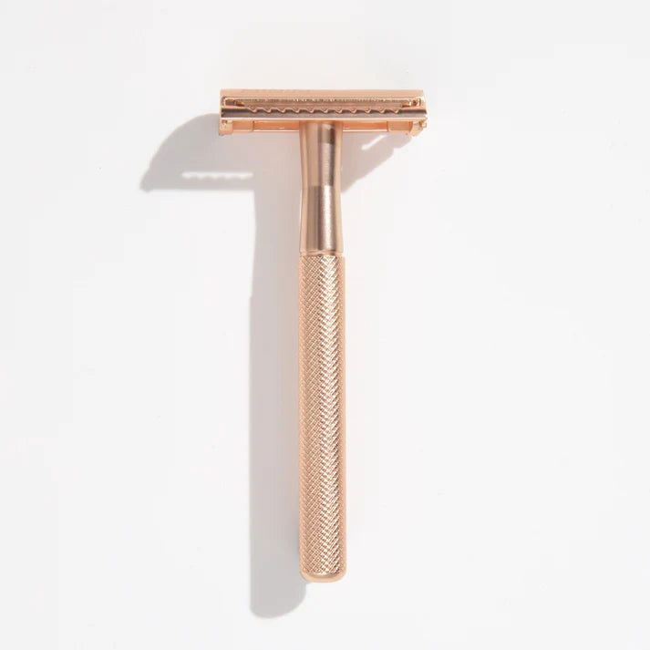 Gold safety razor with textured handle and twin-blade head