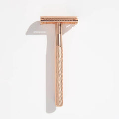 Gold safety razor with textured handle and twin-blade head