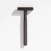 Gunmetal safety razor with textured handle and open comb head