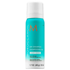 Dry shampoo mini bottle with teal label, white cap, and light tones text