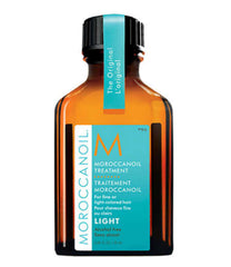 Moroccanoil Treatment Light amber hair oil bottle with black pump cap, 25 ml
