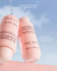 Pair of pink Nourish conditioner bottles, 350 ml, with water droplets