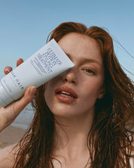 Nak Ultimate Treatment Remedy Repair cream tube, white with blue text, in hand