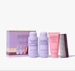Hair care trio pack with purple and pink bottles and striped outer box