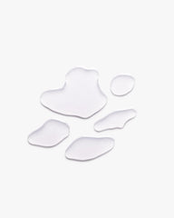 Blonde hair serum swatch shapes on light background