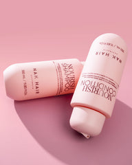 Pink Nourish conditioner bottle and cap, angled view, NAK Hair branding